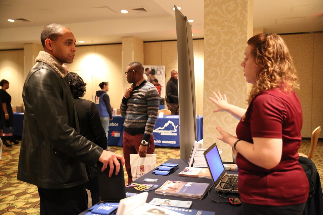 Lance Cpl. Michael Davis, a team member with Personnel Retrieval and Processing Company (-), 4th Marine Logistics Group, speaks to Rhonda Bair, an outreach coordinator with the Department of Veterans Affairs at the Yellow Ribbon Re-Integration Program Post-deployment training conference, Jan. 24-25, 2015 in Washington, D.C. After being deployed to Camp Bastion and Kandahar, Afghanistan, the unit attended the training as a required follow-up to their return to the continental United States. The training featured resources from the Department of Veterans Affairs, the American Red Cross, Employer Support of the Guard and Reserve, Marine For Life, and other organizations which offer financial, medical and employment advice. 