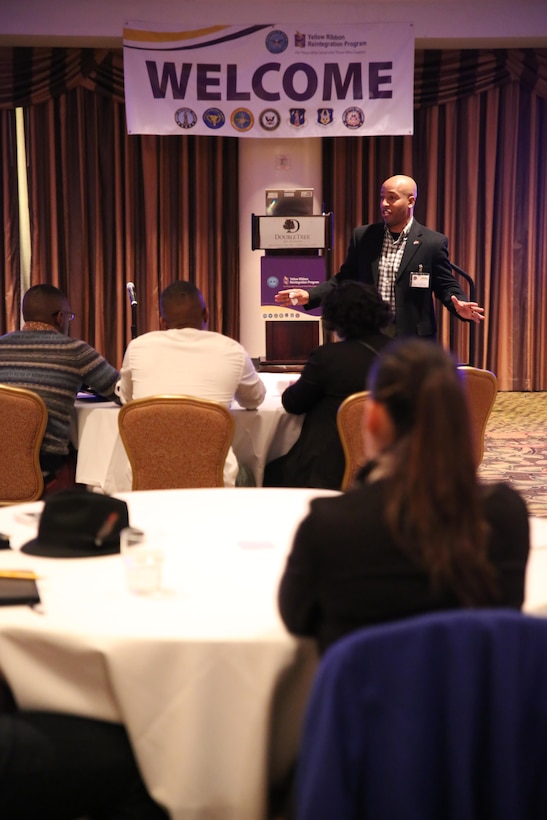 WASHINGTON, D.C. – Sgt. Maj. Gary Smith, sergeant major of 4th Marine Logistics Group, addresses the Marines of Personnel Retrieval and Processing Company (-), 4th MLG, at the Yellow Ribbon Re-Integration Program Post-deployment training conference, Jan. 24-25, 2015 in Washington, D.C. After being deployed to Camp Bastion and Kandahar, Afghanistan, the unit attended the training as a required follow-up to their return to the continental United States. The training featured resources from the Department of Veterans Affairs, the American Red Cross, Employer Support of the Guard and Reserve, Marine For Life, and other organizations which offer financial, medical and employment advice. 