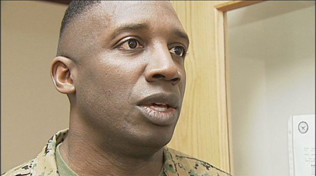First Sergeant Reginald Daniels, Inspector Instructor of company A, 6th Engineer Support Battalion, 4th Marine Logistics Group, stepped up when an American flag was burned in front of a school. Daniels bought a new flag for the school and helped the school hoist it back into its proper place. 