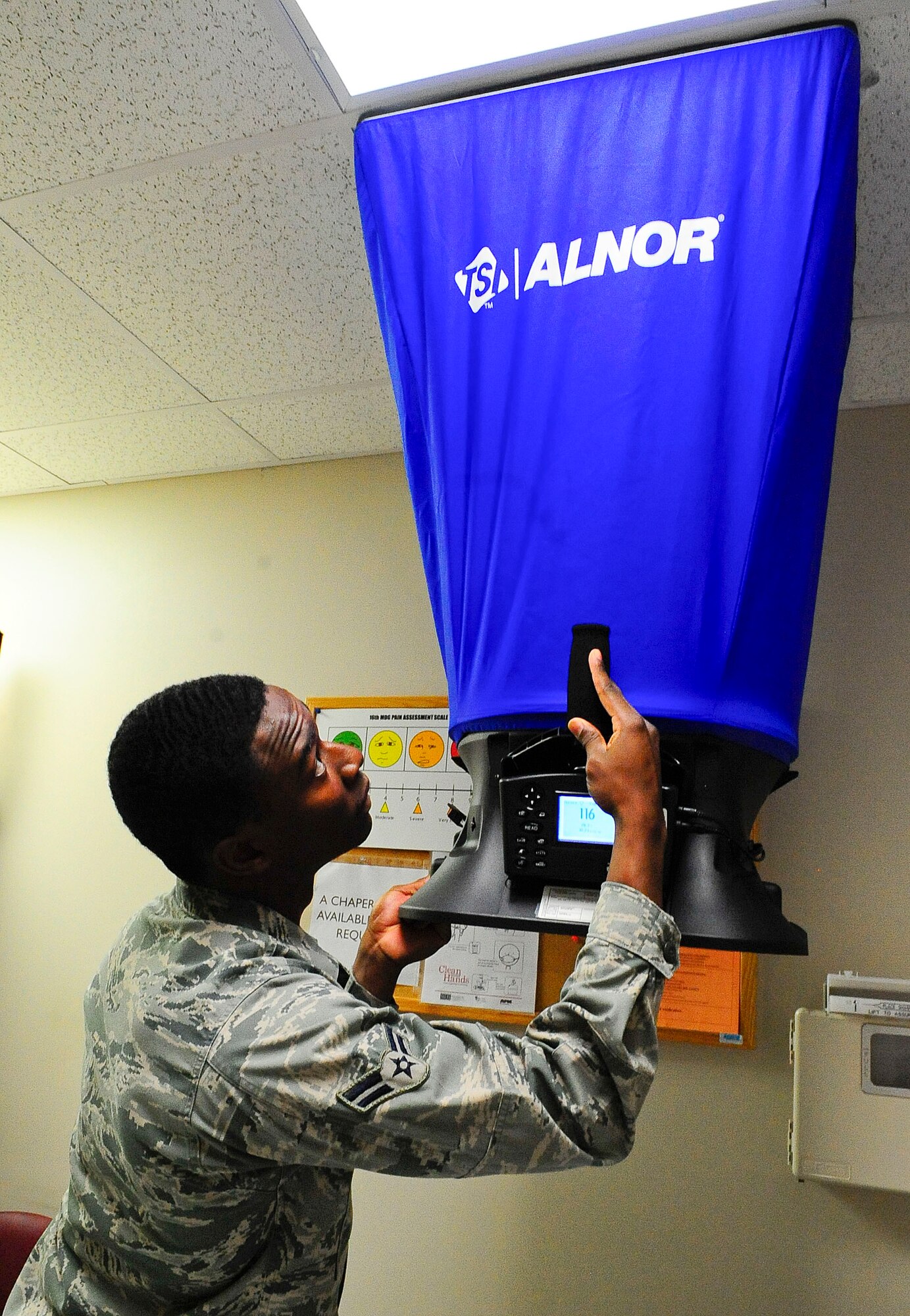 Airman 1st Class Joseph Brown, 1st Special Operations Aerospace Medicine Squadron bioenvironmental engineer technician, uses a bolometer to check a ventilation system on Hurlburt Field, Fla., Jan. 14, 2015. A bolometer ensures exhaust and supplied air systems are working adequately in isolations rooms. (U.S. Air Force photo/Airman 1st Class Andrea Posey)