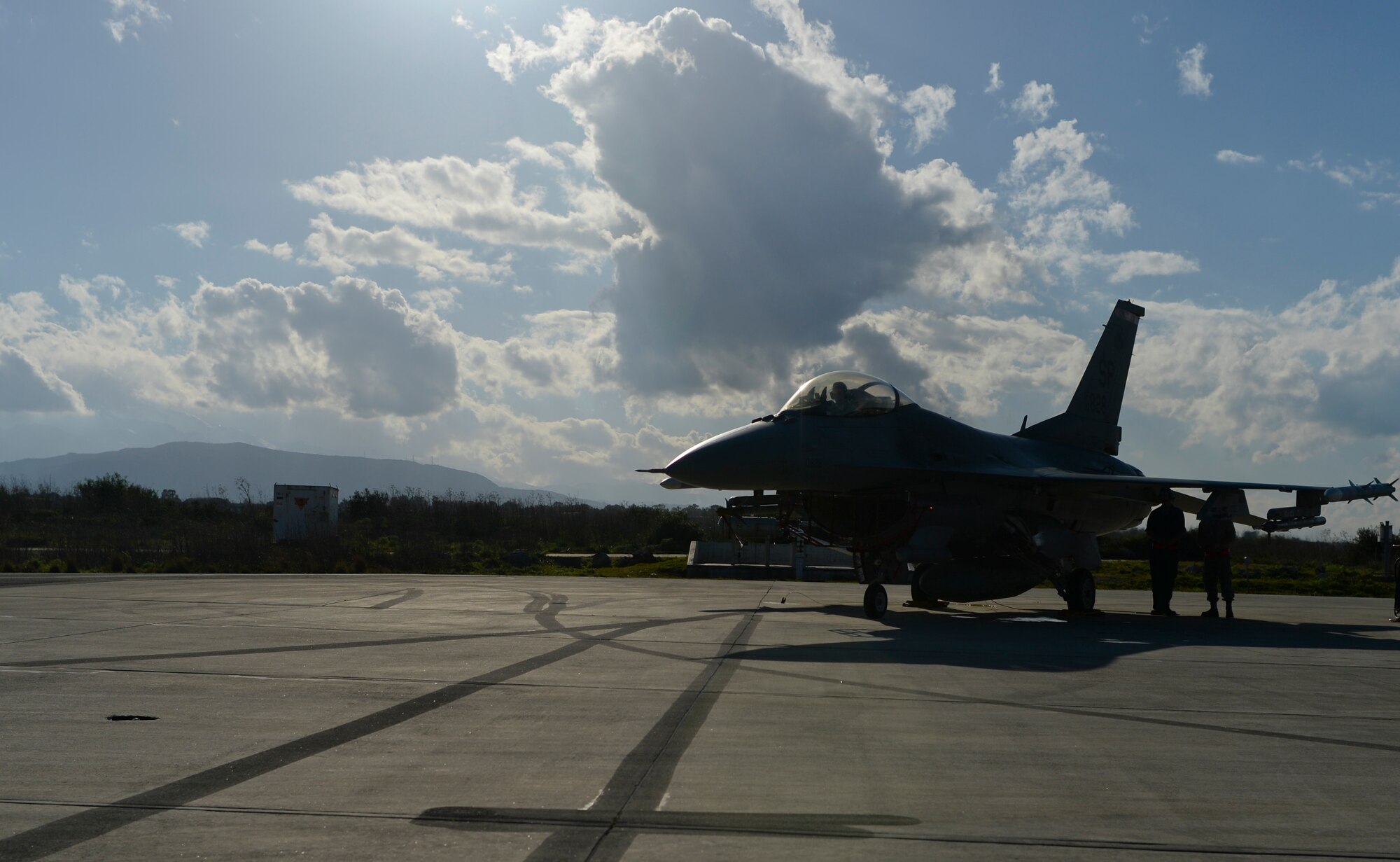 U.S. Air Force dedicated crew chiefs assigned to the 52nd Expeditionary Aircraft Maintenance Squadron service a U.S. Air Force F-16 Fighting Falcon fighter aircraft from the 480th Expeditionary Fighter Squadron during a flying training deployment on the flightline at Souda Bay, Greece, Jan. 26, 2015. The FTD runs from Jan. 16-Feb. 13, 2015, bolsters the U.S. and Greece's joint war-fighting capabilities through combined air operations between the two NATO partners. (U.S. Air Force photo by Staff Sgt. Joe W. McFadden/Released)