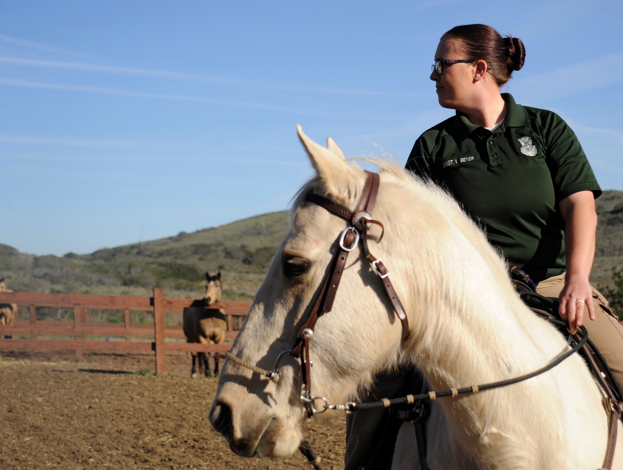 Staff Sgt. Veronica Beyer, 30th Security Forces Squadron horse patrol NCOIC rides Patton around the corral Jan. 14, 2015, Vandenberg Air Force Base, Calif. The conservationists at Vandenberg are responsible for patrolling more than 99,000 acres of land utilizing trucks, ATVs and horses. (U.S. Air Force photo by Airman 1st Class Ian Dudley/Released) 