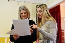Katy Davit (right), Washington State’s VFW Voice of Democracy winner, and her mother Maryann Davit, review the Washington, D.C. trip itinerary, Jan. 24, 2015, at the VFW Post and Auxiliary 2289, Seattle, Wash. Katy will be in Washington, D.C. from March 1 to March 4, 2015 for the national VFW Voice of Democracy audio-essay competition. (U.S. Air Force photo/Senior Airman Rebecca Blossom)