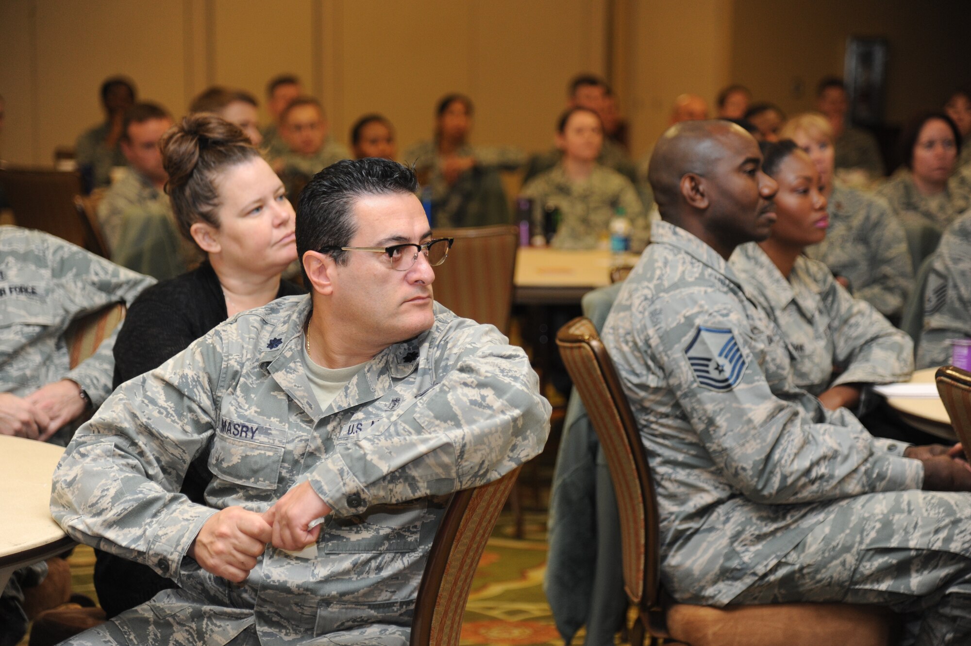 Lt. Col. Salah Masry, 81st Medical Operations Squadron internal medicine flight commander, listens to Col. Thomas Harrell, 81st Medical Group commander, as he speaks to attendees during a 81st MDG flight chief course Jan. 15, 2015, at the Bay Breeze Event Center, Keesler Air Force Base, Miss.  .  Approximately 90 military members and 10 spouses attended the two day leadership event.  (U.S. Air Force photo by Kemberly Groue)