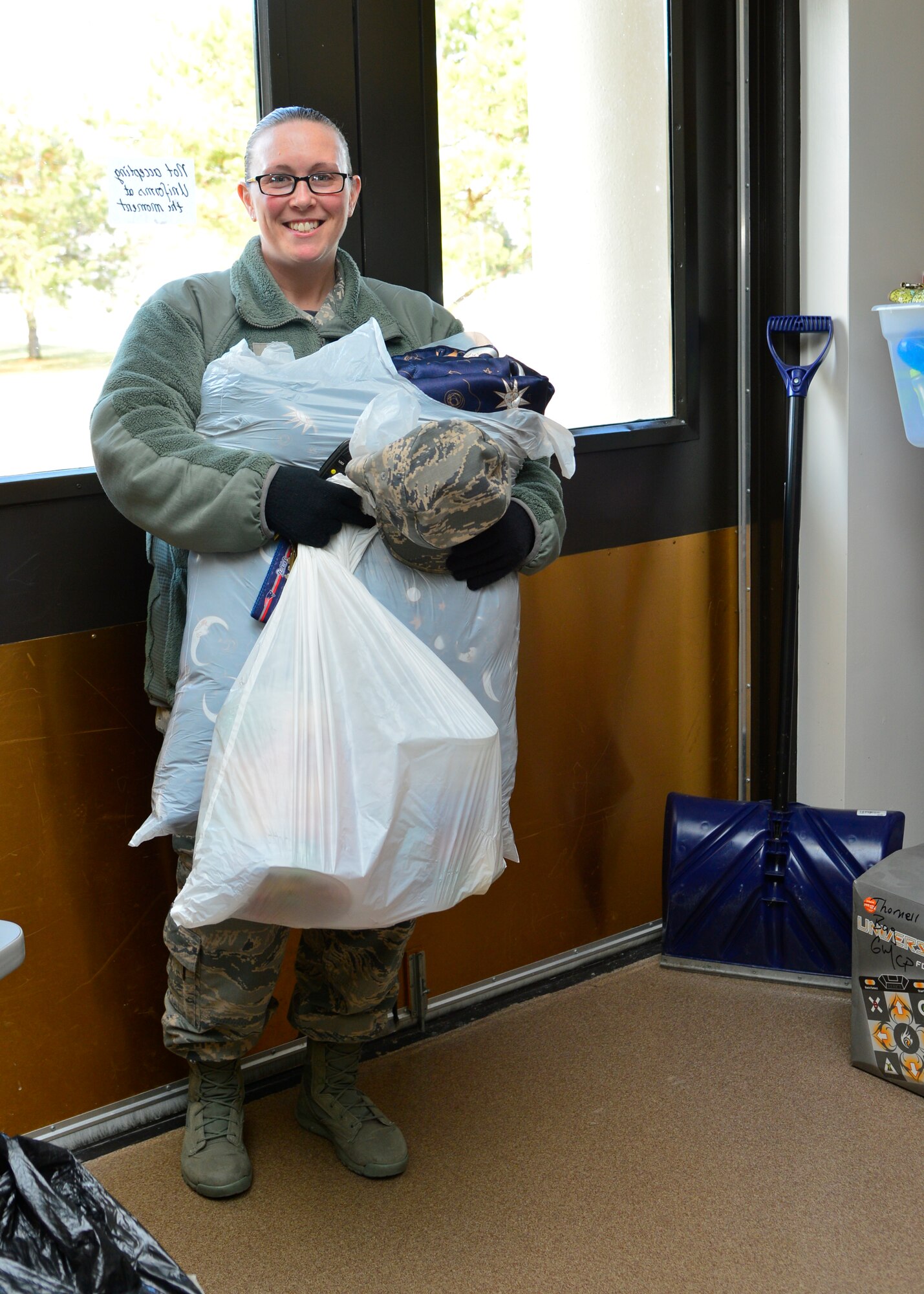 Master Sgt. Breah Misho, 436th Operation Support Squadron first sergeant, delivers donated gifts to the Airman’s Attic Jan. 23, 2015, at Dover Air Force Base, Del. The Airman’s Attic takes donated items which Airmen E-5 and below can come shop through for free. (U.S. Air Force photo/Airman 1st Class William Johnson)