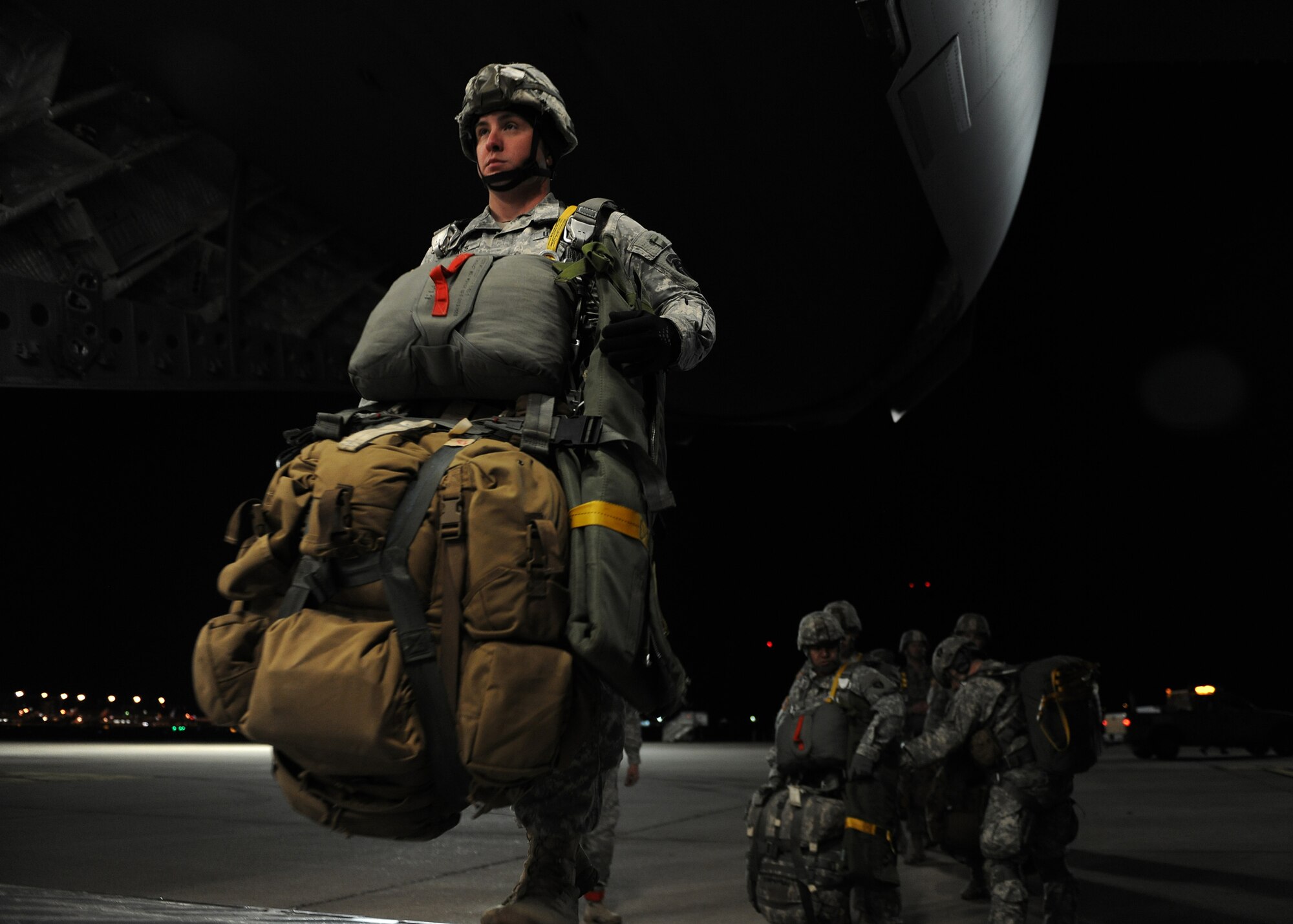 ALTUS AIR FORCE BASE, Okla. – A Texas Army National Guard Soldier from the 1st Battalion, 143rd Infantry Regiment walks up the cargo ramp of a U.S. Air Force C-17 Globemaster III cargo aircraft in Austin, Texas, Jan. 23, 2015.  Many of the Soldiers gear weighed up to 95 pounds. (U.S. Air Force photo by Airman 1st Class Nathan Clark/Released)
