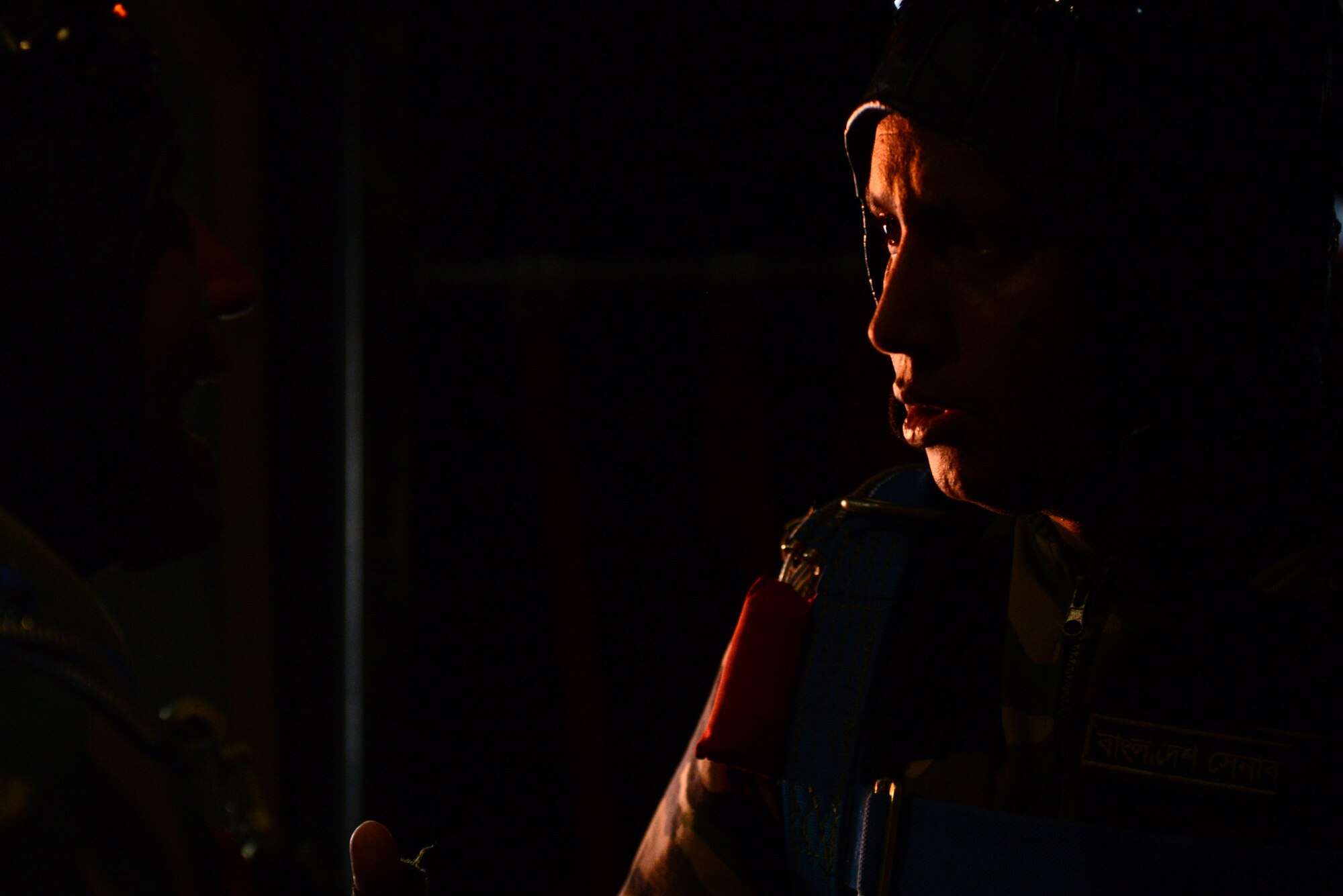 A Bangladeshi paratrooper prepares to jump from a U.S. Air Force C-130H aircraft during Exercise COPE SOUTH near Sylhet, Bangladesh, Jan. 24, 2015. COPE SOUTH is a Pacific Air Forces-sponsored, bilateral tactical airlift exercise conducted in Bangladesh, with a focus on cooperative flight operations, day and night low-level navigation, tactical airdrop, and air-land missions as well as subject-matter expert exchanges in the fields of operations, maintenance and rigging disciplines. (U.S. Air Force photo by 1st Lt. Jake Bailey/Released)