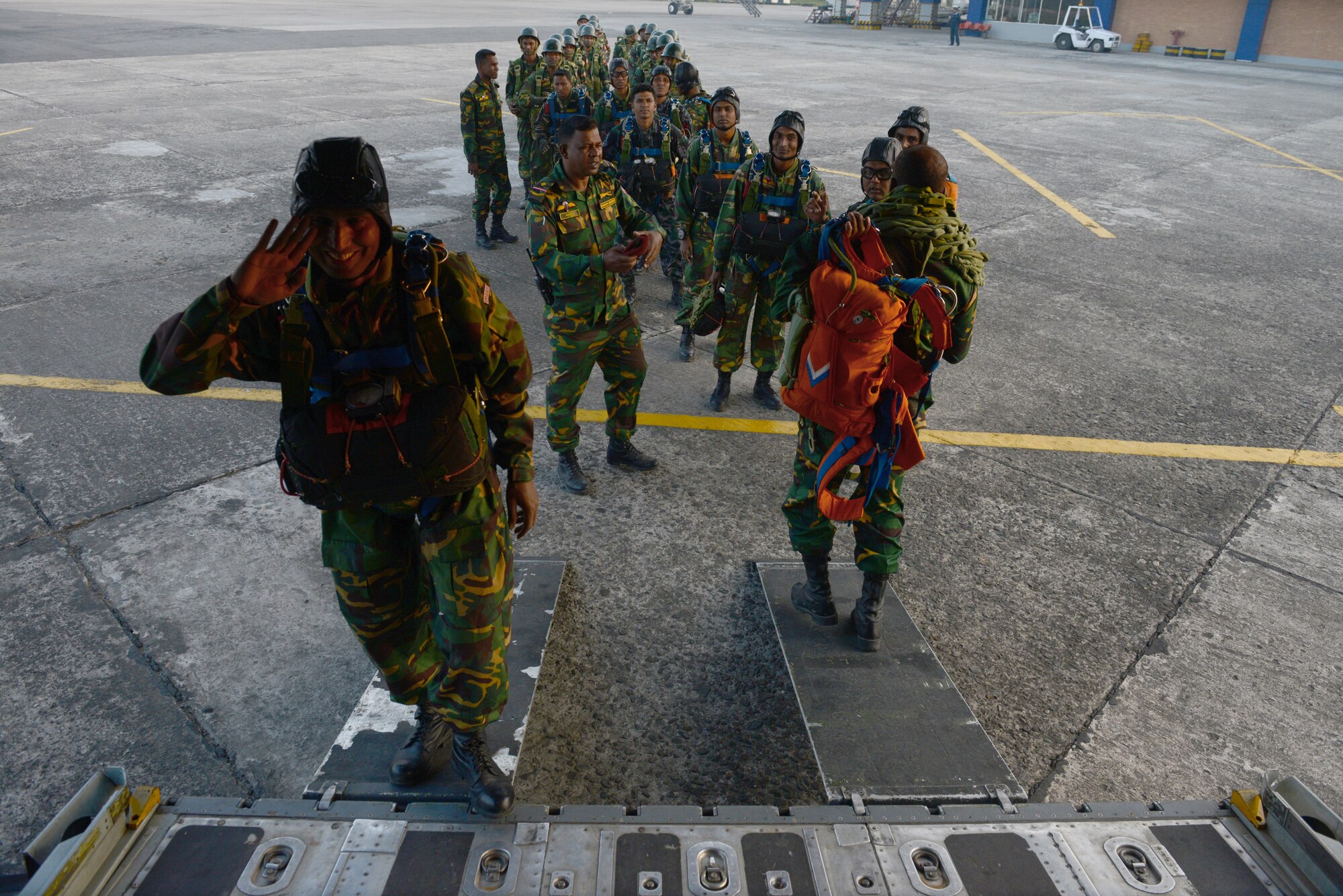 Bangladeshi commandos board a U.S. Air Force C-130H aircraft at Sylhet International Airport, Bangladesh, before conducting a personnel airdrop mission during Exercise COPE SOUTH, Jan. 24, 2015. COPE SOUTH is a Pacific Air Forces-sponsored, bilateral tactical airlift exercise conducted in Bangladesh, with a focus on cooperative flight operations, day and night low-level navigation, tactical airdrop, and air-land missions as well as subject-matter expert exchanges in the fields of operations, maintenance and rigging disciplines. (U.S. Air Force photo by 1st Lt. Jake Bailey/Released)