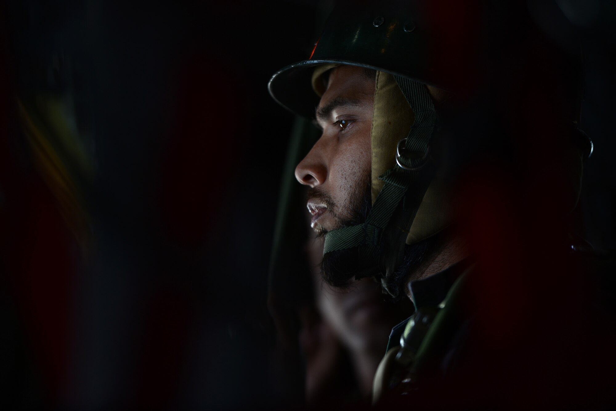 A Bangladeshi paratrooper prepares to jump from a U.S. Air Force C-130H aircraft during Exercise COPE SOUTH near Sylhet, Bangladesh, Jan. 24, 2015. COPE SOUTH is a Pacific Air Forces-sponsored, bilateral tactical airlift exercise conducted in Bangladesh, with a focus on cooperative flight operations, day and night low-level navigation, tactical airdrop, and air-land missions as well as subject-matter expert exchanges in the fields of operations, maintenance and rigging disciplines. (U.S. Air Force photo by 1st Lt. Jake Bailey/Released)