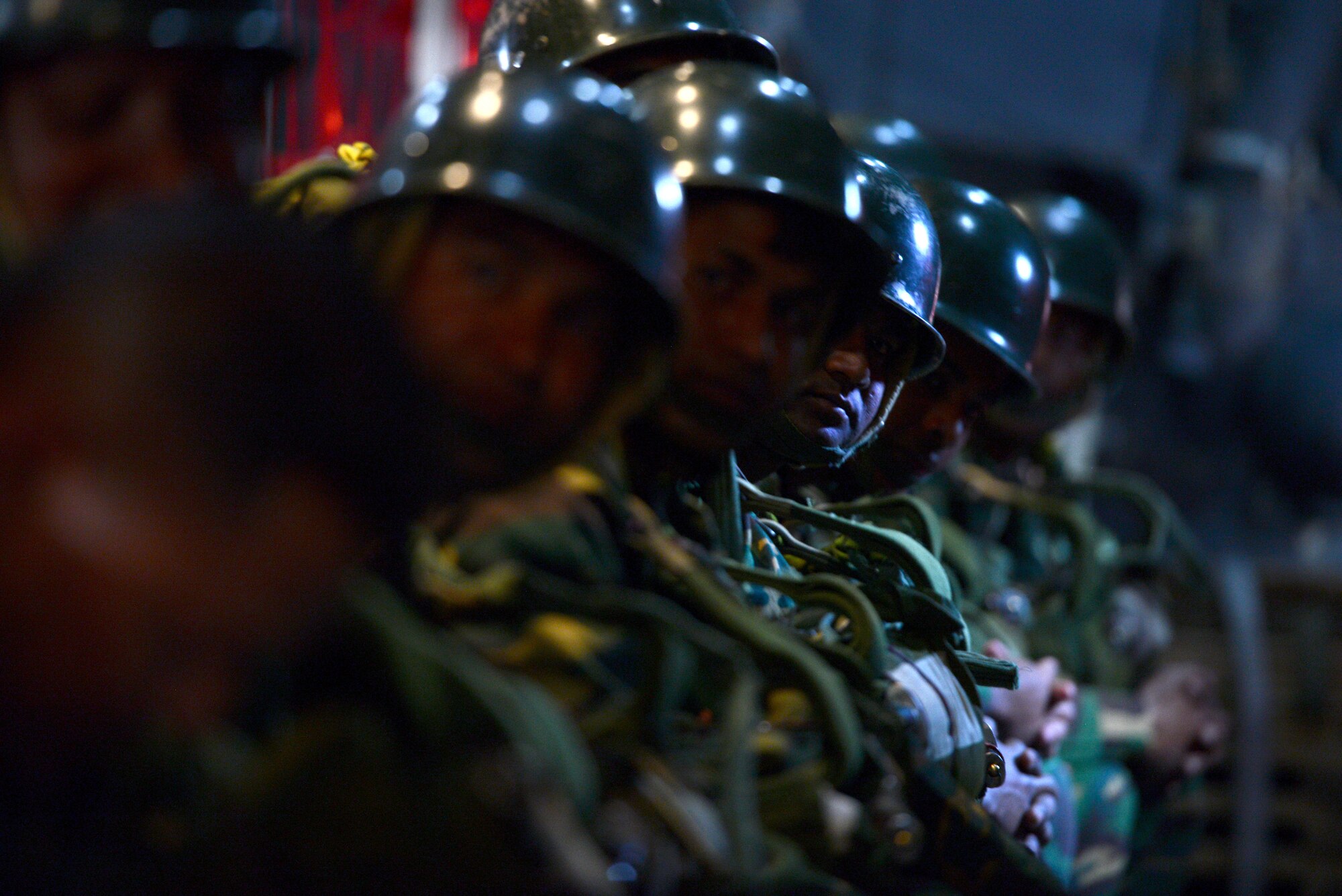 Bangladeshi commandos prepare to jump from a U.S. Air Force C-130H aircraft during Exercise COPE SOUTH near Sylhet, Bangladesh, Jan. 24, 2015. COPE SOUTH helps cultivate common bonds, foster goodwill, and improve readiness and compatibility between members of the Bangladesh and U.S. Air Forces. COPE SOUTH is a Pacific Air Forces-sponsored, bilateral tactical airlift exercise conducted in Bangladesh, with a focus on cooperative flight operations, day and night low-level navigation, tactical airdrop, and air-land missions as well as subject-matter expert exchanges in the fields of operations, maintenance and rigging disciplines. (U.S. Air Force photo by 1st Lt. Jake Bailey/Released)