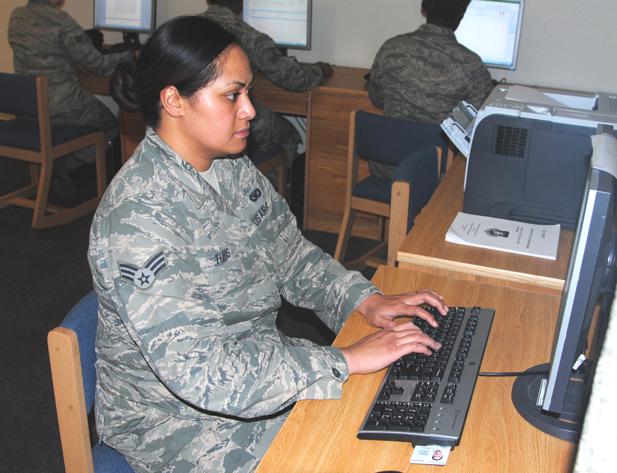 Senior Airman Tatiana Tubbs, 377th Security Forces Squadron, uses a networked computer in the newly-opened Defenders Den. (Photo by Jim Fisher)
