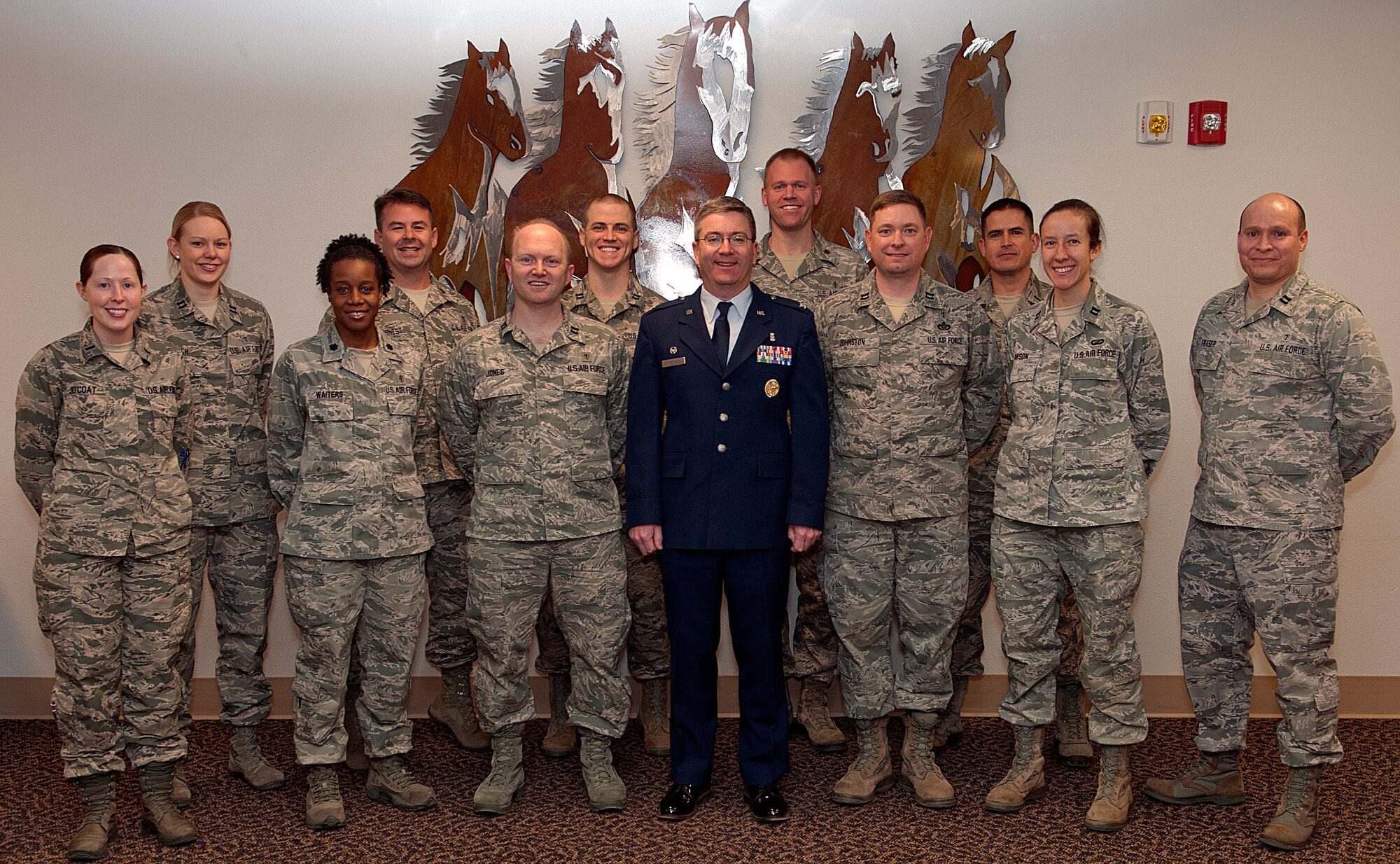 Col. Hans Ritschard, 90th Medical Group commander, poses with the group’s Biomedical Sciences Corps Jan. 22, 2015, in the MDG conference room. Eight of the 15 BSC career fields are represented at the 90th MDG, including public health, physician assistant, behavior health, pharmacy, optometry and physical therapy. (U.S. Air Force Photo by Airman 1st Class Malcolm Mayfield)