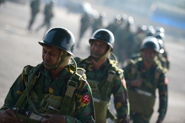 Bangladeshi commandos board a U.S. Air Force C-130H aircraft at Sylhet International Airport, Bangladesh, before conducting a personnel airdrop mission during Exercise COPE SOUTH, Jan. 24, 2015. COPE SOUTH helps cultivate common bonds, foster goodwill, and improve readiness and compatibility between members of the Bangladesh and U.S. Air Forces. (U.S. Air Force photo by 1st Lt. Jake Bailey/Released)