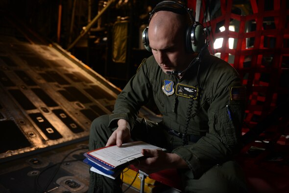 U.S. Air Force Staff Sgt. Noel Jones, a C-130H loadmaster assigned to the 36th Airlift Squadron, Yokota Air Base, Japan, reviews a checklist before conducting an personnel airdrop mission supporting Exercise COPE SOUTH at BAF Base Bangabandhu, Bangladesh, Jan. 24, 2015. COPE SOUTH helps cultivate common bonds, foster goodwill, and improve readiness and compatibility between members of the Bangladesh and U.S. Air Forces. (U.S. Air Force photo by 1st Lt. Jake Bailey/Released)