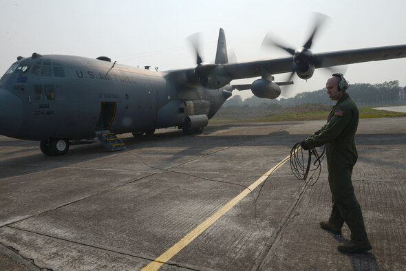 U.S. Air Force Staff Sgt. Noel Jones, a loadmaster assigned to the 36th Airlift Squadron, Yokota Air Base, Japan, prepares to board a C-130H aircraft after engines start during Exercise COPE SOUTH at BAF Base Bangabandhu, Bangladesh, Jan. 24, 2015. COPE SOUTH helps cultivate common bonds, foster goodwill, and improve readiness and compatibility between members of the Bangladesh and U.S. Air Forces. (U.S. Air Force photo by 1st Lt. Jake Bailey/Released)