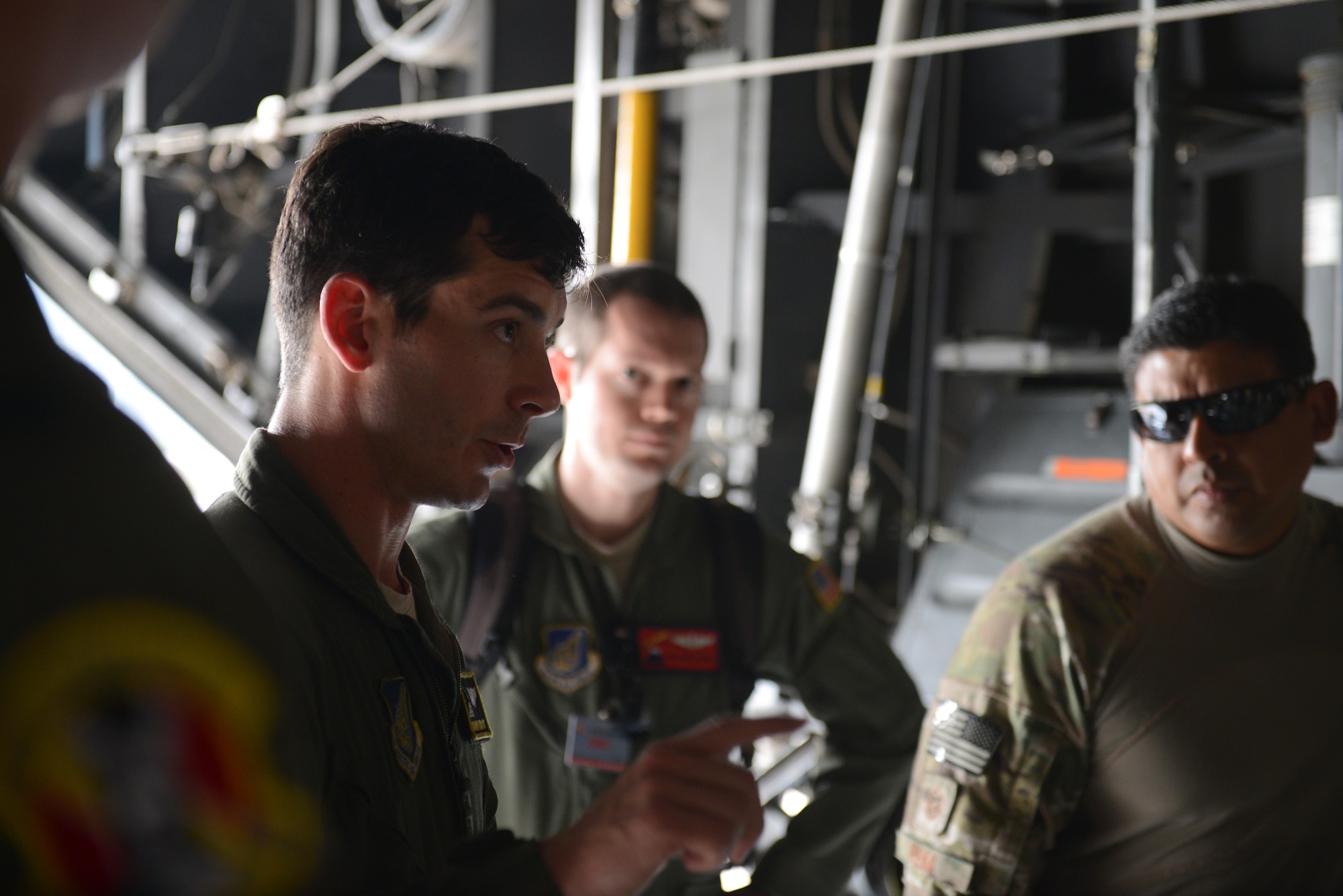 U.S. Air Force Capt. Shawn Hooton, a C-130H aircraft pilot assigned to the 36th Airlift Squadron, Yokota Air Base, Japan, briefs fellow crew members before a personal airdrop mission during Exercise COPE SOUTH at BAF Base Bangabandhu, Bangladesh, Jan. 24, 2015. COPE SOUTH is a Pacific Air Forces-sponsored, bilateral tactical airlift exercise conducted in Bangladesh, with a focus on cooperative flight operations, day and night low-level navigation, tactical airdrop, and air-land missions as well as subject-matter expert exchanges in the fields of operations, maintenance and rigging disciplines. COPE SOUTH helps cultivate common bonds, foster goodwill, and improve readiness and compatibility between members of the Bangladesh and U.S. Air Forces. (U.S. Air Force photo by 1st Lt. Jake Bailey/Released)