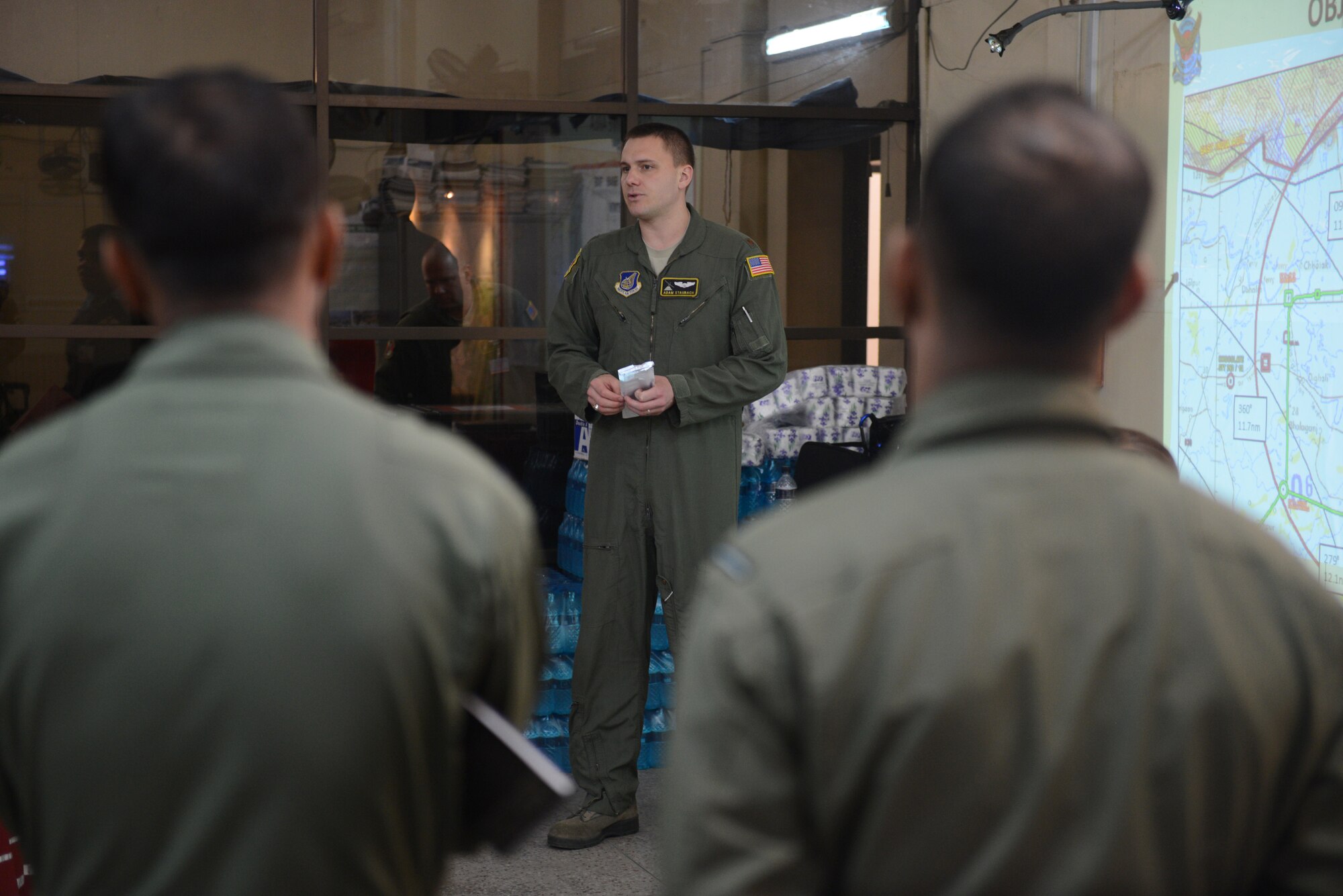 U.S. Air Force Maj. Adam Staubach, Exercise COPE SOUTH mission commander, briefs fellow a bilateral contingent of crew members before a personal airdrop mission during Exercise COPE SOUTH at BAF Base Bangabandhu, Bangladesh, Jan. 24, 2015. COPE SOUTH helps cultivate common bonds, foster goodwill, and improve readiness and compatibility between members of the Bangladesh and U.S. Air Forces. (U.S. Air Force photo by 1st Lt. Jake Bailey/Released)