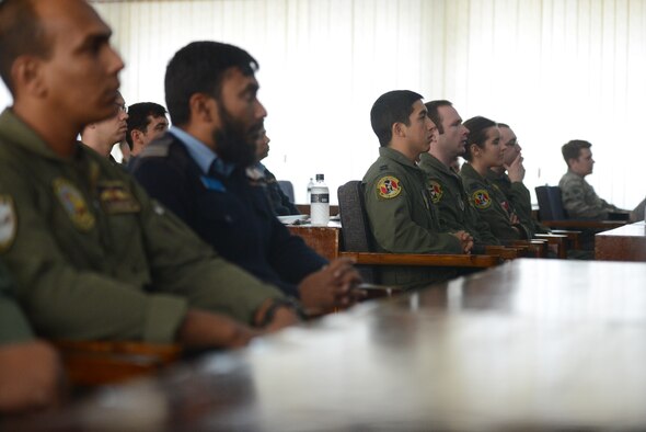 U.S. Air Force and Bangladesh Air Force members attend a bilateral crew brief before the launch of Exercise COPE SOUTH at BAF Base Bangabandhu, Bangladesh, Jan. 24, 2015. COPE SOUTH helps cultivate common bonds, foster goodwill, and improve readiness and compatibility between members of the Bangladesh and U.S. Air Forces. (U.S. Air Force photo by 1st Lt. Jake Bailey/Released)