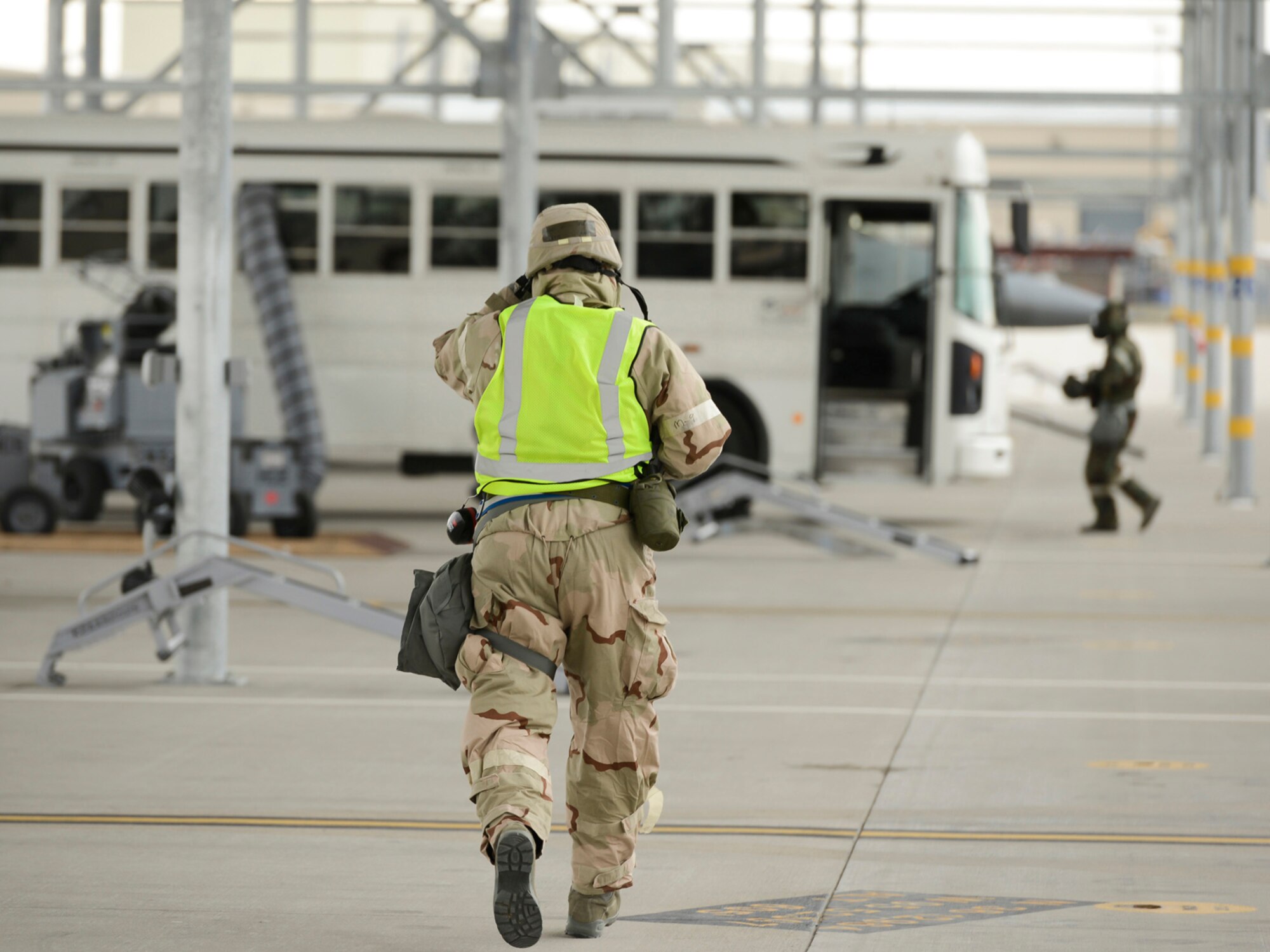Weapon loaders, assigned to the 138th Maintenance Group, practice loading training munitions onto an F-16 during an operational readiness exercise (ORE) held, Jan. 10, 2015, at the Tulsa Air National Guard Base, Okla. The 138th Fighter Wing conducted the ORE to assess the 138th Fighter Wing's ability to accomplish design operational capability tasking in a contested, degraded operational environment utilizing ability to survive and operate principles.  (U.S. National Guard photo by Master Sgt.  Mark A. Moore/Released)