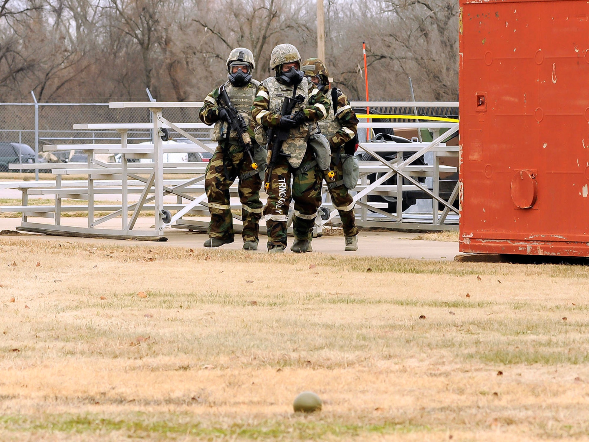 Members of the 138th Security Forces post attack reconnaissance team encounter an unexploded ordinance (UXO) while conducting a sweep around their assigned post during an exercise held on January 10, 2015, at the 138th Fighter Wing.  Tulsa Air National Guard members participated in refresher force protection training to reinforce chemical, biological and self-buddy aid practices.  (U.S. National Guard photo by Tech Sgt. Roberta A. Thompson/Released)