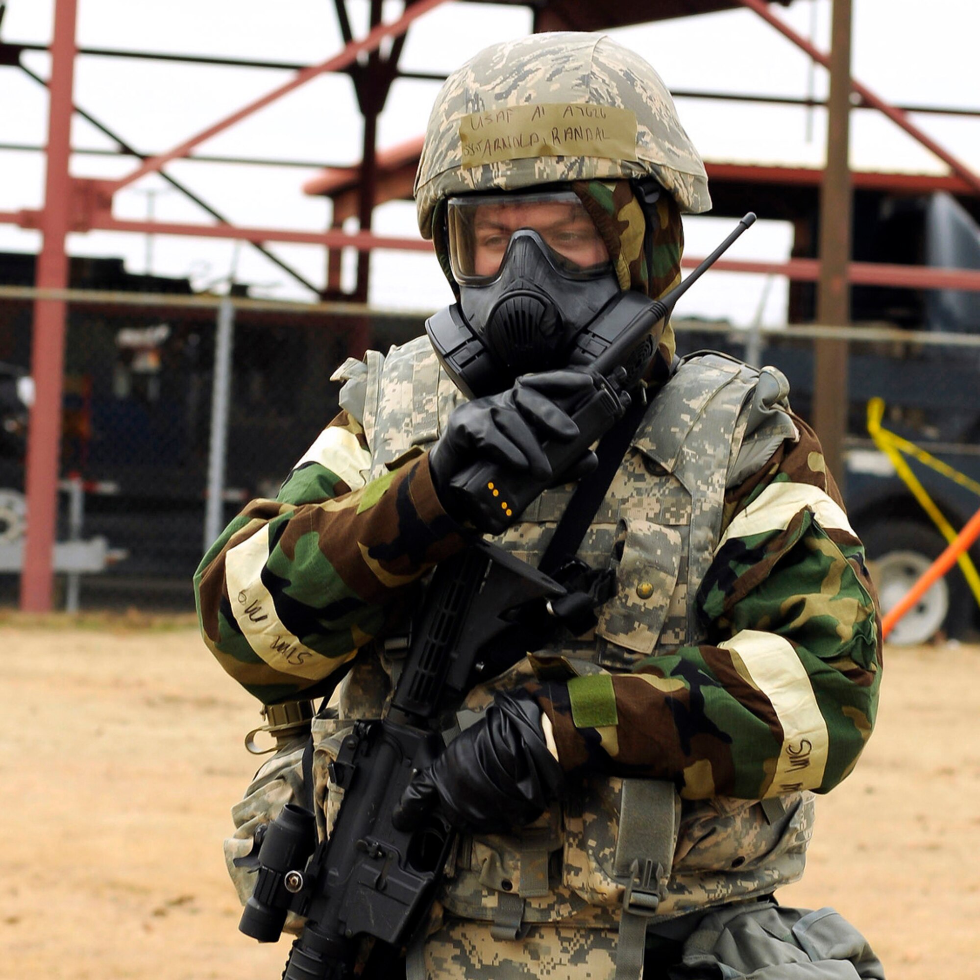 Staff Sgt. Randal Arnold, 138th Security Forces, reports information of an unexploded ordinance found while conducting a post attack reconnaissance, during a wing exercise on January 10, 2015, at the 138th Fighter Wing.  Tulsa Air National Guard members participated in refresher force protection training to reinforce chemical, biological and self-buddy aid practices.  (U.S. National Guard photo by Tech. Sgt. Roberta A. Thompson/Released)