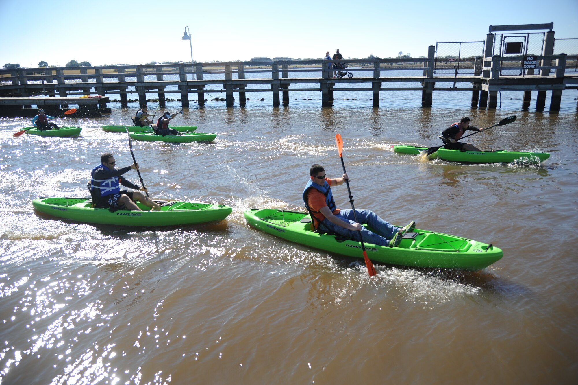The first heat of kayak races begins during the third annual Polar Bear Regatta Jan. 24, 2015, at Marina Park, Keesler Air Force Base, Miss.  The event was sponsored by outdoor recreation. (U.S. Air Force photo by Kemberly Groue)