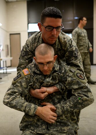 Staff Sgt. Robert Macpeek, 628th Logistics Readiness Squadron vehicle maintenance supervisor, practices a one man drag with Sgt. Nicholas Gunter, a member of the 941st Transportation Company, during a joint service Combat Lifesaver Course , Jan. 22, 2015, at Joint Base Charleston, S.C.,  The event was hosted by Soldiers stationed at Fort Jackson, S.C. Forty-three students participated in the course which is designed to teach lifesaving skills to non-medical military personnel (U.S. Air Force photo/Senior Airman Jared Trimarchi)  