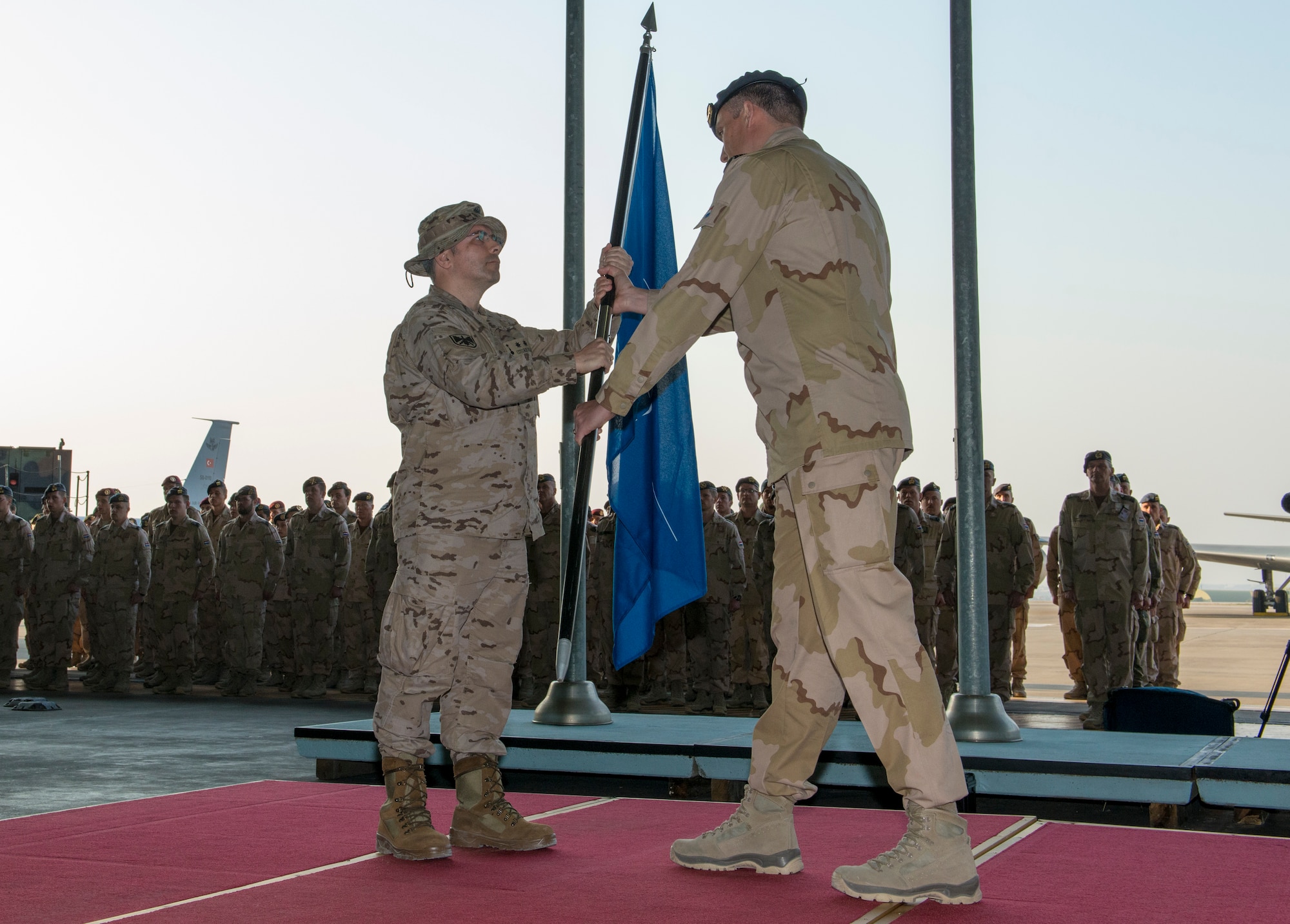 CDR. Jorge Cotorruelo, Spanish Patriot Unit commander, receives command of the North Atlantic Treaty Organization mission Operation Active Fence from Col. Niels Vredegoor, 1st Netherlands Ballistic Missile Defense Task Force commander, during a change of responsibility ceremony Jan. 26, 2015, at Incirlik Air Base Turkey. Operation Active Fence is part of the NATO patriot missile support mission, which includes the missile batteries operated by the U.S. and Germany, located respectively in two other areas within Turkey: Kahramanmaras and Gaziantep. (U.S. Air Force photo by Airman Cory W. Bush/Released)