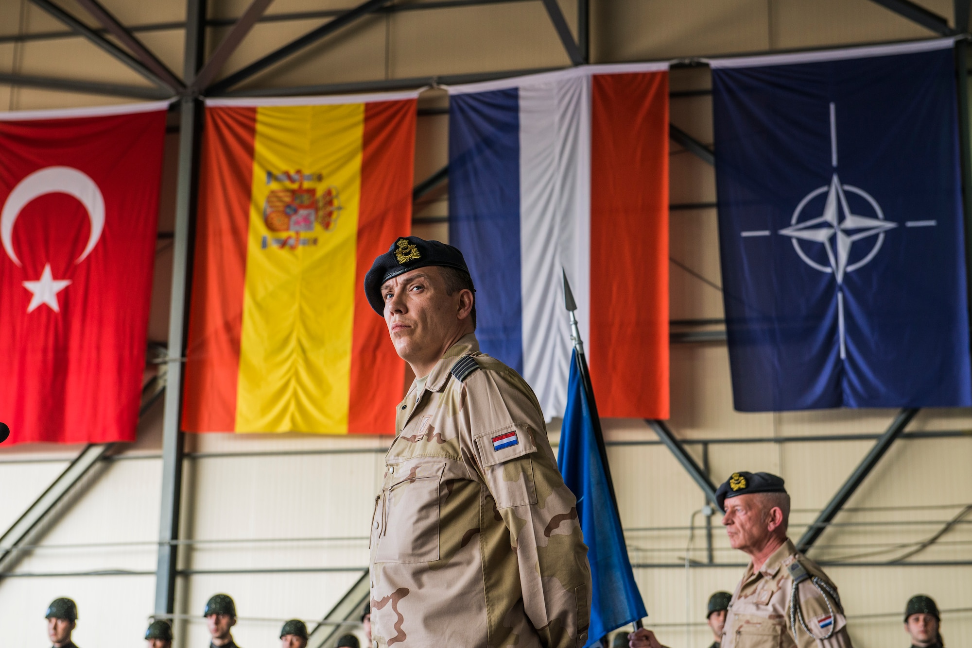 Col. Niels Vredegoor, 1st Netherlands Ballistic Missile Defense Task Force commander, stands at the podium during a change of responsibility ceremony Jan. 26, 2015, at Incirlik Air Base, Turkey. While no missiles have been launched at Turkey during their stay, members of the Dutch army and air force have provided round-the-clock coverage for the last two years. (U.S. Air Force photo by Airman Cory W. Bush/Released) 