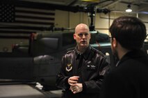 Lt. Col. Chris Brady, 54th Helicopter Squadron commander, briefs Dr. Jamie Morin, Director, Cost Assessment and Program Evaluation, about the capabilities of the UH-1N Helicopter on Minot Air Force Base, N.D., Jan. 12, 2014. During his visit to the base, Morin also visited various units’ across the base and a missile alert facility. (U.S. Air Force photo/Senior Airman Malia Jenkins) 