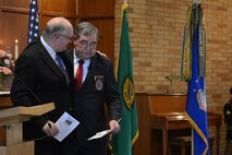 Chaplain Gary K. Cowden(left) embraces Staff Sgt. John Campbell, Air Force veteran, after Campbell’s Purple Heart ceremony Jan. 25, 2015 at American Lake Chapel, Tacoma, Wash. More than 100 members in attendance, including members of Team McChord, local government agencies, community supporters and family watched as Campbell was presented his Purple Heart by Congressman Derek Kilmer for wounds sustained in Laos in Jan. 1, 1970. (U.S. Air Force photo\ Staff Sgt. Tim Chacon)
