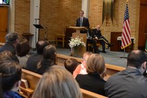 Congressman Derek Kilmer, 6th District of Washington, speaks during a Purple Heart ceremony for Staff Sgt. John Campbell, Air Force veteran, Jan. 25, 2015 at American Lake Chapel, Tacoma, Wash.  Kilmer spoke of Campbell’s service and the events of Jan. 1, 1970 in Laos that led to Campbell receiving the Purple Heart. (U.S. Air Force photo\ Staff Sgt. Tim Chacon)