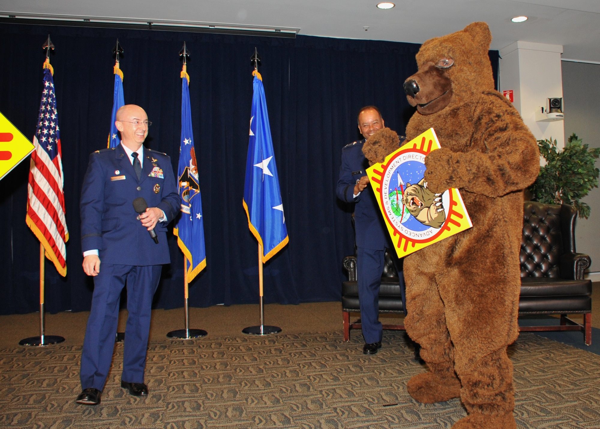 AD's bear mascot shows the new directorate's logo at the AD standup ceremony, Jan. 9. (Photo by Sarah Corrice)