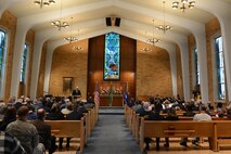 Chaplain Gary Cowden speaks during a Purple Heart ceremony for Staff Sgt. John Campbell, Air Force veteran, Jan. 25, 2015 at American Lake Chapel, Tacoma, Wash.  Campbell served in the Air Force from July 1966 to July 1970. He received the Purple Heart for injuries he sustained during an attack Jan. 1, 1970 in Laos. (U.S. Air Force photo\ Staff Sgt. Tim Chacon)