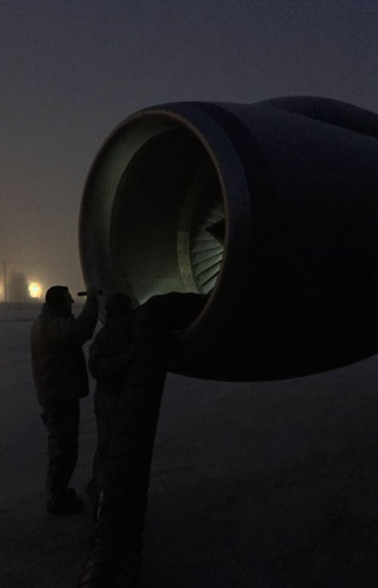 Airmen from JOINT BASE ELMENDORF-RICHARDSON, Alaska, work on a  KC-135 Stratotanker assigned to McConnell Air Force Base, Kan., Jan. 21, 2015.  The KC-135 was operated by an aircrew from the Air Force Reserve 931st Air Refueling Group at McConnell. (U.S. Air Force photo by Senior Master Sgt. Ray Lewis)
