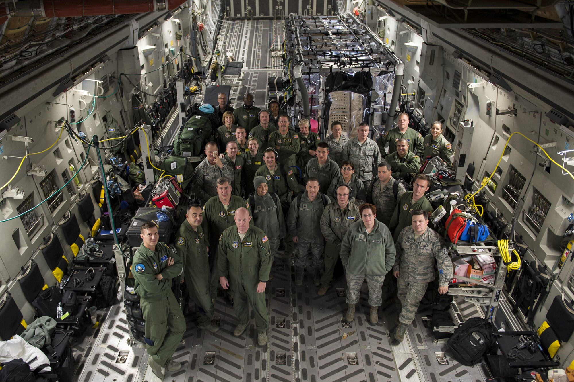 Airmen from Joint Base Charleston and the Air Force Operational Test and Evaluation Center build, test and evaluate the Transport Isolation System (TIS) at JB Charleston, Dec. 13, 2014. The TIS is a self-contained module system that can be used with either two or three sections, depending on aircraft space. It will be used to safely transport patients with an infectious disease. (U.S. Air Force photo by Airman 1st Class Taylor Queen/Released)