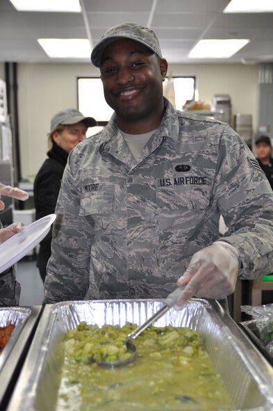 Air Force Reserve Senior Airman Mark Moore, a Services Cook assigned to the 910th Force Support Squadron (FSS), serves a meal side dish during lunch of the Unit Training Assembly here, Jan. 10, 2015. The 910th FSS provides leadership and supervision of support services to the 910th Airlift Wing through the Military Personnel Section, Wing Education & Training and Family Support sections. The squadron exercises overall direction and control over contingency operation for deploy/redeployment and in wartime, provides personnel account-ability/reporting, force management and casualty reporting at established and bare bases. Additionally, the 910th FSS trains and equips personnel to meet wartime requirements. The squadron also provides combat support for Air Force operational forces in food service, lodging, mortuary affairs, fitness, field exchange, recreation activities and self-help laundries. U.S. Air Force photo by Tech. Sgt. Valerie Smock.