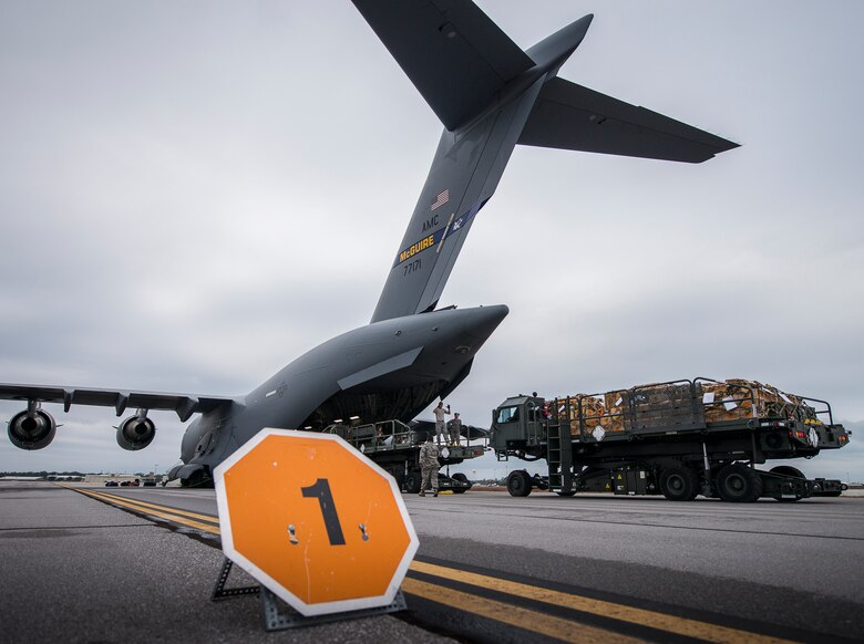 A pallet loader moves into place to begin unloading its cargo onto a C-17 Globemaster III Jan. 13 at Duke Field, Fla.  The 96th Logistics Readiness Squadron’s aerial operations crew loaded more than 100,000 pounds of ammunition from the 7th Special Forces Group onto the aircraft during the upload.  (U.S. Air Force photo/Tech. Sgt. Sam King)