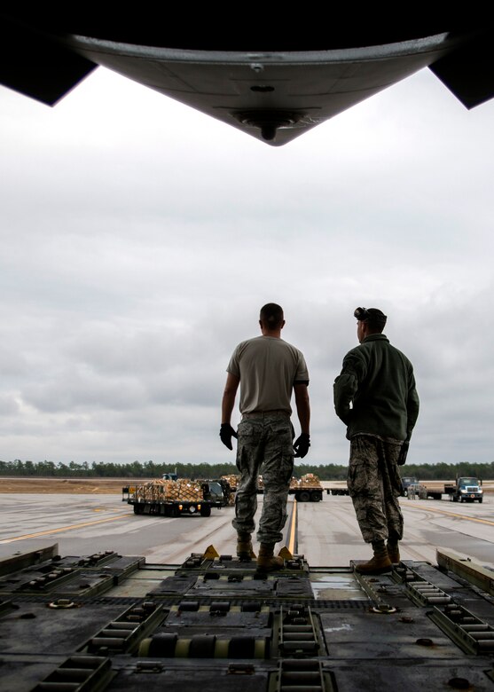 Aerial operations Airmen from the 96th Logistics Readiness Squadron wait inside a C-17 Globemaster III for the next pallet to arrive Jan. 13 at Duke Field, Fla.  The LRS crew loaded more than 100,000 pounds of ammunition from the 7th Special Forces Group onto the aircraft during the upload.  (U.S. Air Force photo/Tech. Sgt. Cheryl Foster)