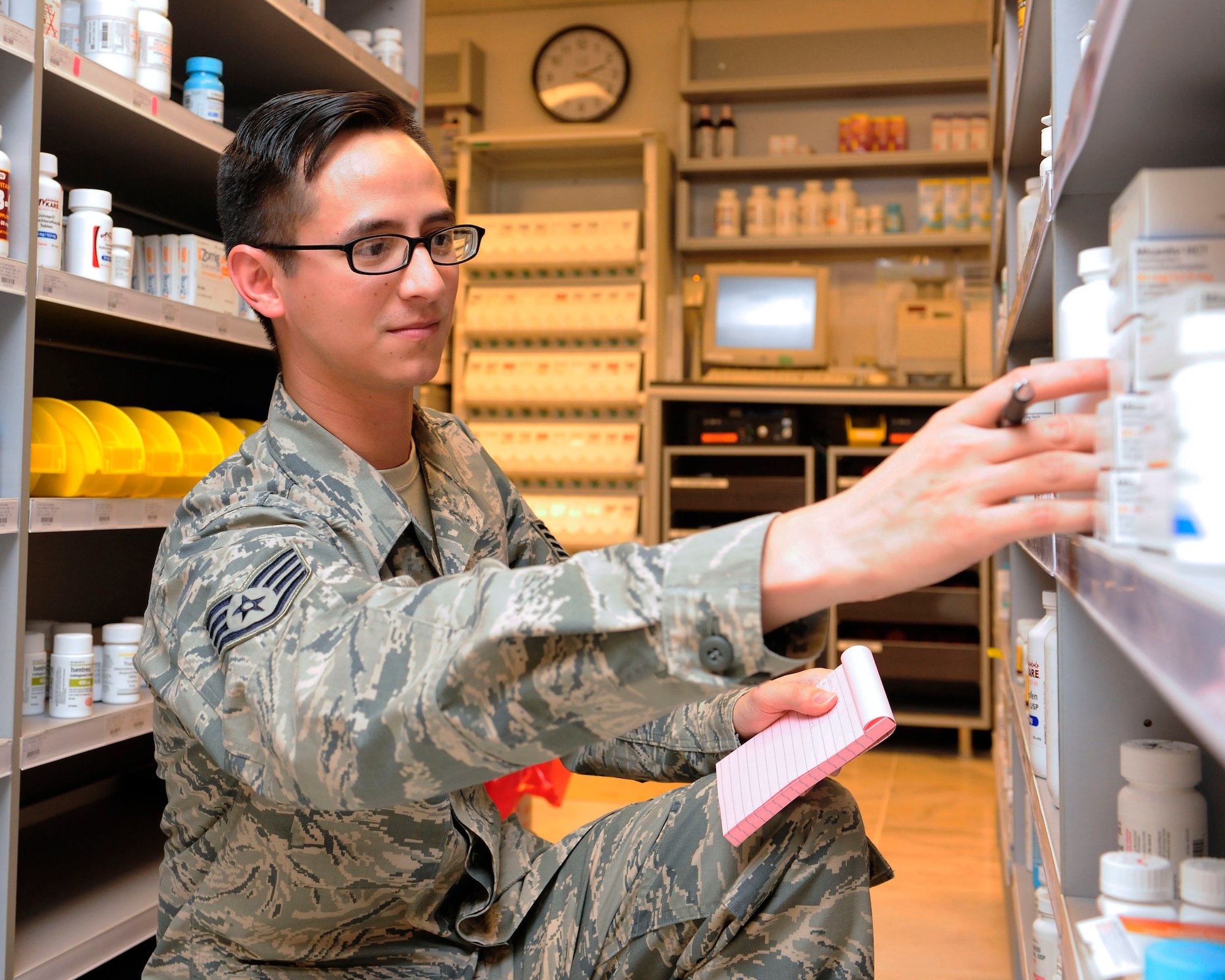 Staff Sgt. Andrew Banales, 39th Medical Group NCO in charge of pharmacy support, checks medication expiration dates Jan. 21, 2015, at Incirlik Air Base, Turkey. Members of the pharmacy staff routinely inspect the medication supply to ensure that medicine distributed is safe for use. (U.S. Air Force photo by Senior Airman Krystal Ardrey/Released)
