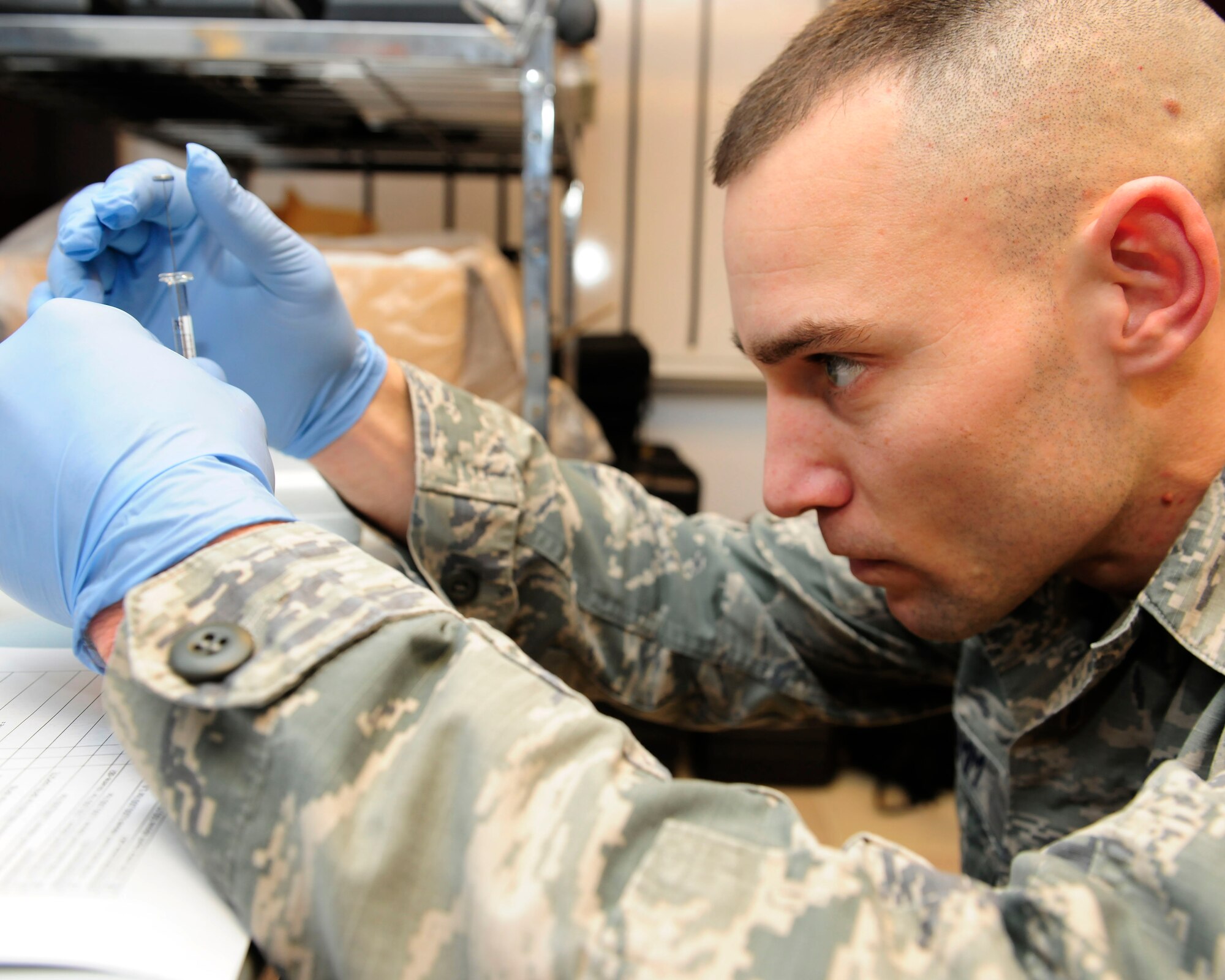 Staff Sgt. Jeffry Stamm, 39th Medical Group NCO in charge of contingency health readiness, prepares a water sample to test for any volatile organic compounds Jan. 21, 2015, at Incirlik Air Base, Turkey. Using a Hazardous Air Pollutants on Site Emergency Response machine, Stamm can test and analyze volatile organic compounds, toxic industrial chemicals or materials and chemical warfare agents. (U.S. Air Force photo by Senior Airman Krystal Ardrey/Released)