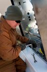 Senior Airman Adam Rivers, 5th Civil Engineer Squadron water and fuels system journeyman, constructs a fuel dispenser on Minot Air Force Base, N.D., Jan. 13, 2015. Rivers worked with Airmen from 5th Logistics Readiness Squadron petroleum, oil and lubrication section, and the 5th CES electrical section. (U.S. Air Force photo/Airman 1st Class Sahara L. Fales)