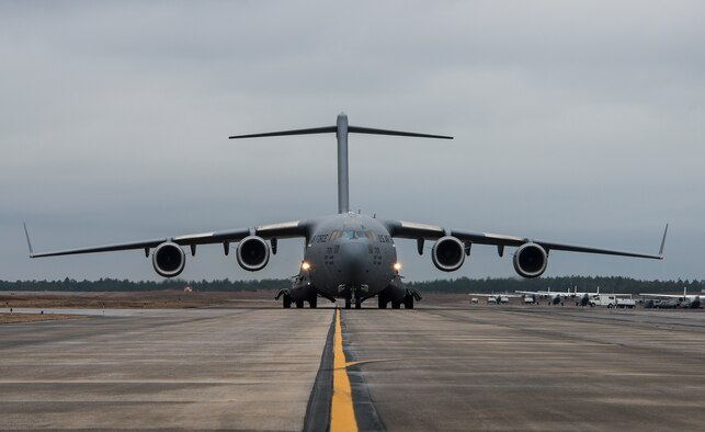A 305th Air Mobility Wing C-17 Globemaster III from Joint Base McGuire-Dix-Lakehurst, N.J., taxies toward its destination Jan. 13, at Duke Field, Fla.  The aircrew picked up more than 100,000 pounds of ammunition from the 7th Special Forces Group during their stop.  (U.S. Air Force photo/Tech. Sgt. Cheryl Foster)