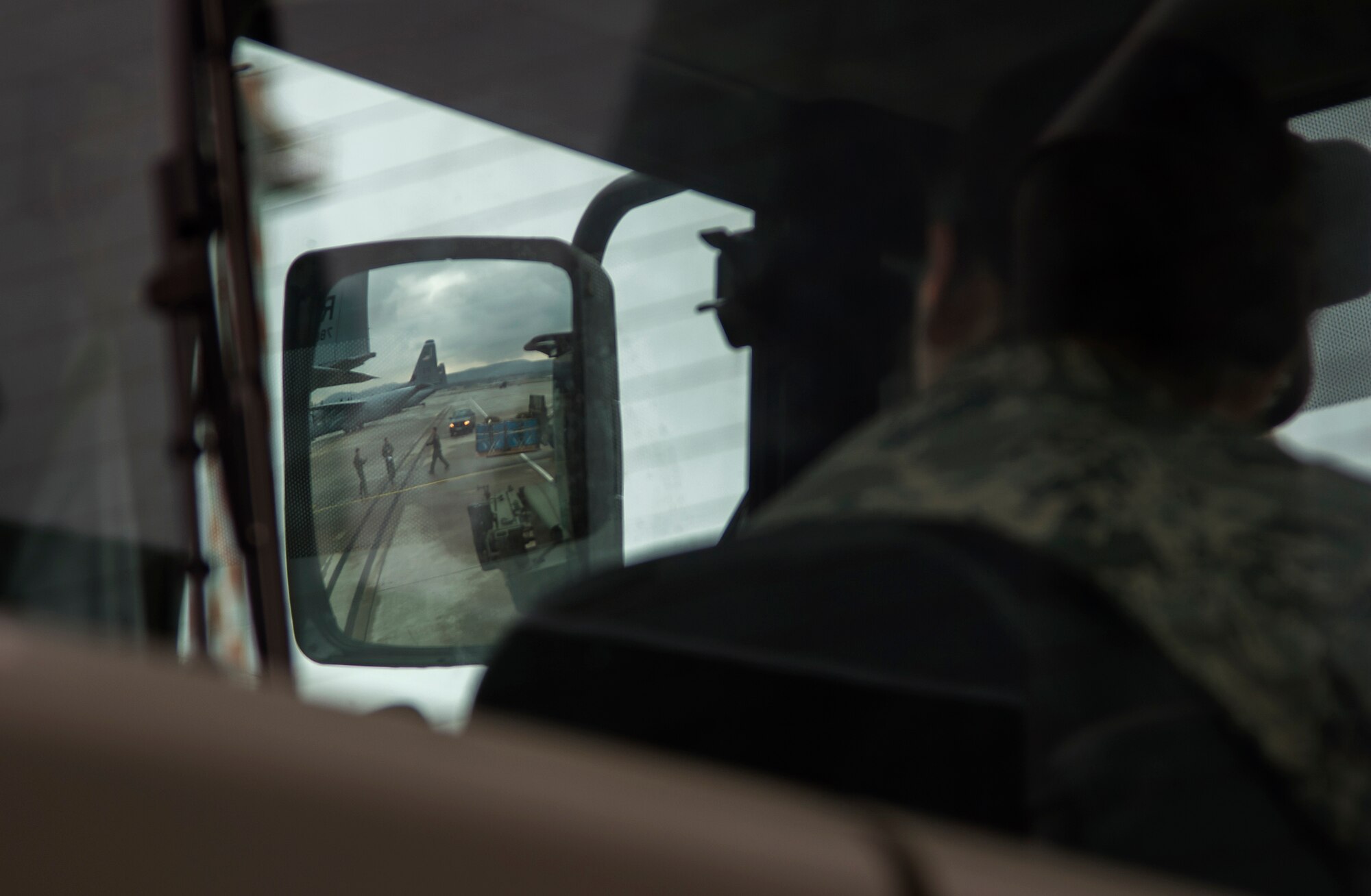 Tech Sgt. Megan Johnson, 86th Logistics Readiness Squadron aerial delivery NCO in charge, watches as loadmasters from the 37th Airlift Squadron guide a fork lift into a C-130J Super Hercules at Ramstein Air Base, Germany, Jan. 20, 2015. Members of the 86th LRS aerial delivery assist the 37th AS with their airdrop training by providing a variety of training bundles from heavy platforms to container deployment systems. (U.S. Air Force photo/Senior Airman Damon Kasberg)