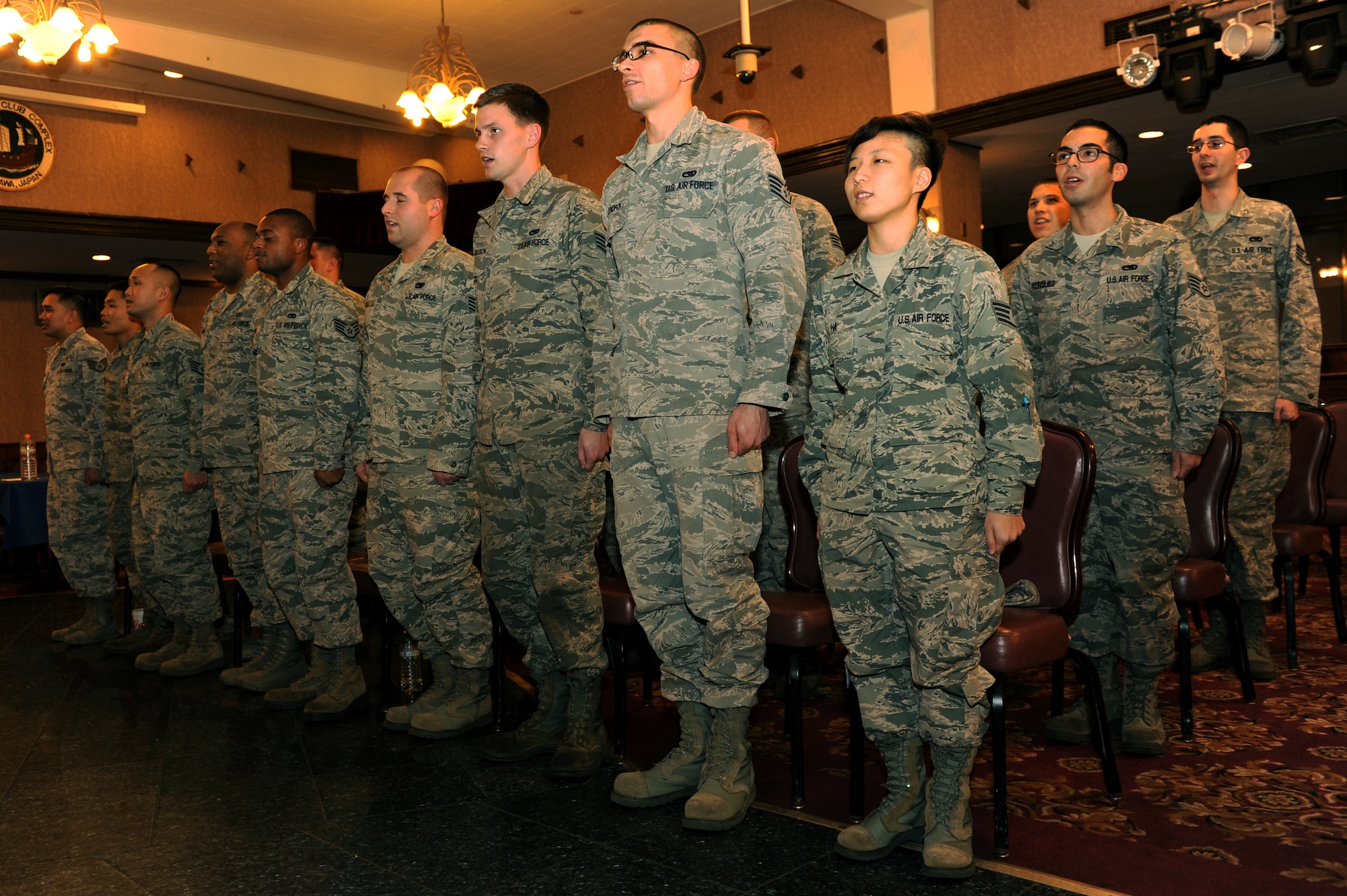 Newly inducted NCOs recite the Airman’s Creed during their induction ceremony at the Rocker NCO Club on Kadena Air Base, Japan, Jan. 22, 2015. The ceremony recognizes those who have recently put on the rank of staff sergeant, reaching the NCO tier of enlisted Airmen. (U.S. Air Force photo by Airman 1st Class Zade C. Vadnais)