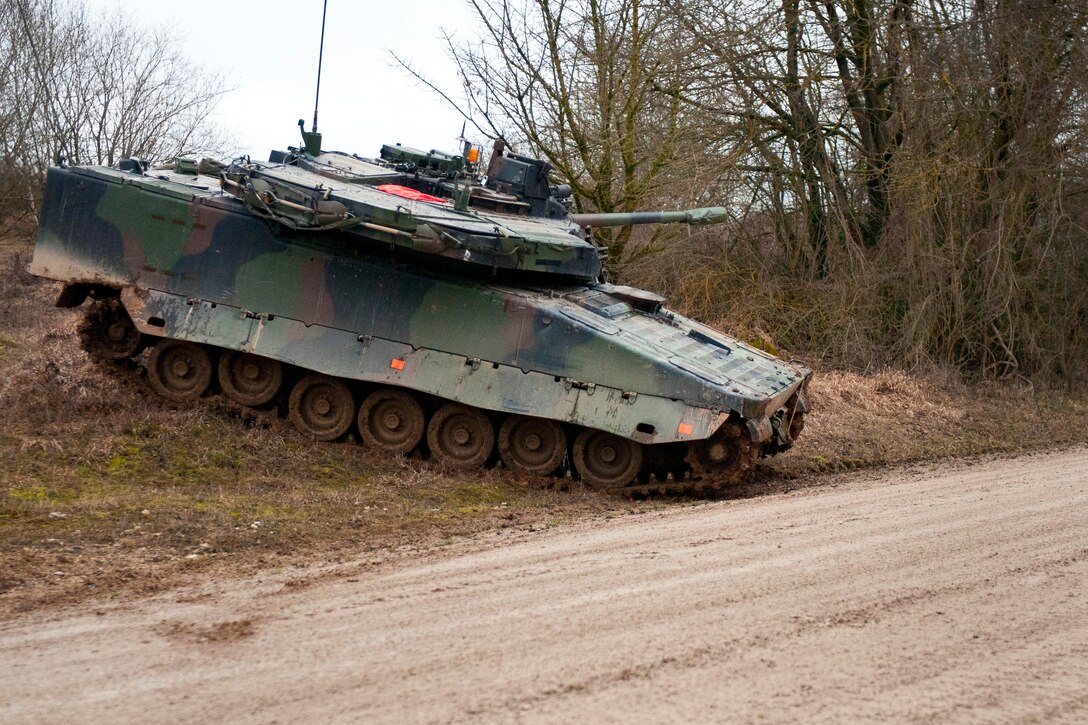 A Dutch army tank prepares for an assault on an obstacle as it provides security for other tanks during exercise Allied Spirit I at Hohenfels Training Center, Hohenfels, Germany, Jan. 17, 2015. 