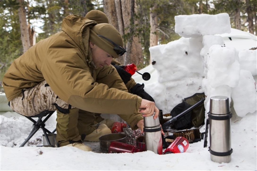 Marine Corps Lance Cpl. Ryan Molik prepares to melt snow to make drinking water for his fellow Marines during a training exercise on the U.S. Marine Corps Mountain Warfare Training Center in Bridgeport, Calif., Jan. 22, 2015. Molik is assigned to Combat Logistics Battalion 26, 2nd Marine Logistics Group.