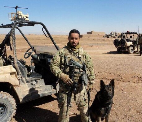 Tech. Sgt. Steven Bruner, 56th Security Forces Squadron military working dog handler, and Chrach, 56th SFS MWD, pose for a photo in Afghanistan during their 2012 deployment. Chrach was recently awarded the 12th Annual Animal Hero Award from the Arizona Friends of Animals Organization for his service to the community and deployment to Afghanistan. (Courtesy photo)