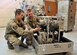 Tech. Sgt. Robert Richards and Airman 1st Class Benjamin Vlietstra  look over a guided missile maintenance platform motor Jan. 21, 2015, at Malmstrom Air Force Base, Mont. All 17 of the 341st Missile Wing’s GMMPs -- also known as work cages -- were available for service Jan. 14, ensuring that missile maintenance in Minuteman III launch facilities stays on schedule. Richards is a mechanical and pneudraulics section team chief and team trainer, and Vlietstra is a power, refrigeration and electrical laboratory technician with the 341st Maintenance Operations Squadron. (U.S. Air Force photo/John Turner) 