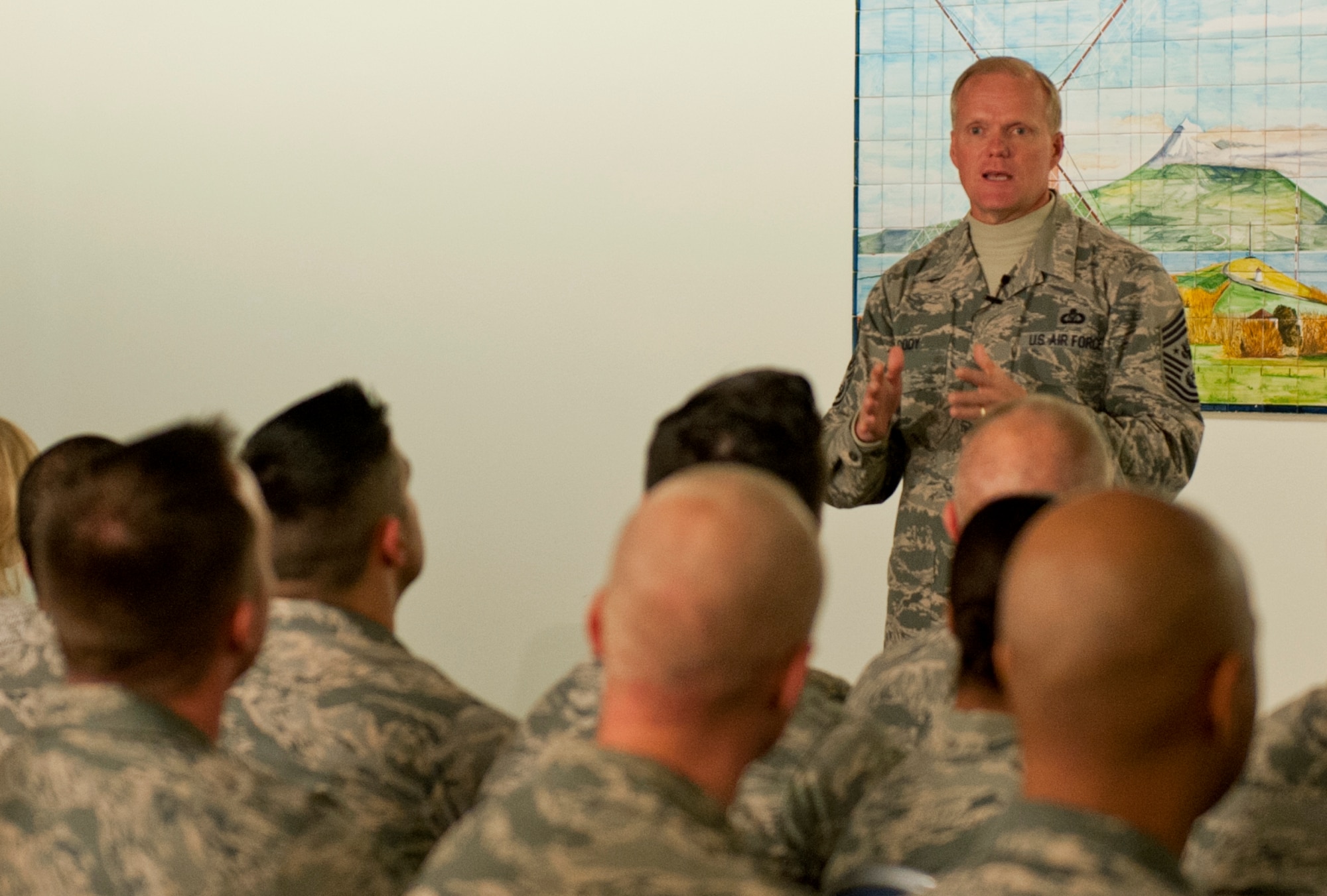 Chief Master Sgt. of the Air Force James A. Cody speaks to Airmen during an all call Jan. 26, 2015 at the 65th Air Base Wing, Lajes Field, Azores, Portugal . Cody is currently on a tour of bases within the United States Air Forces in Europe command to express his gratitude to Airmen, listen to their concerns and answer their questions. (U.S. Air Force photo/Staff Sgt. Zachary Wolf)